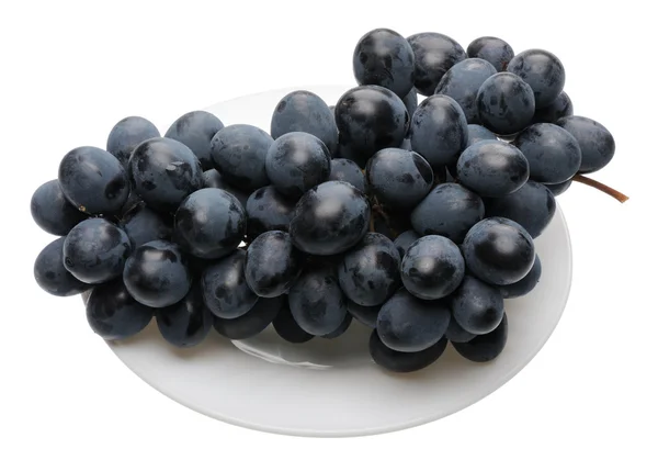 Black grapes on the plate — Stock Photo, Image
