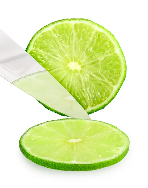 Cutting fresh green lime — Stock Photo, Image