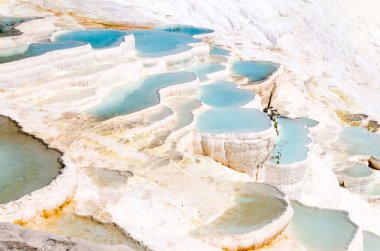 Turquoise water travertine pools at pamukkale clipart