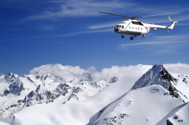 Helicopter in winter mountains clipart