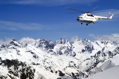 Heliski in high mountains clipart