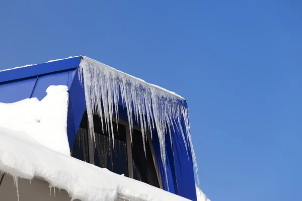 Snowy attic with icicles — Stock Photo, Image