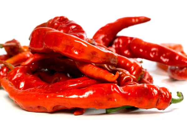 Red chili peppers with water drops on white background — Stock Photo, Image