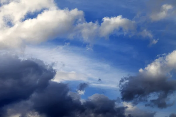 Blue sky with sunlight and storm clouds — Stock Photo, Image