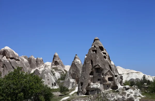 Cave houses and church — Stock Photo, Image