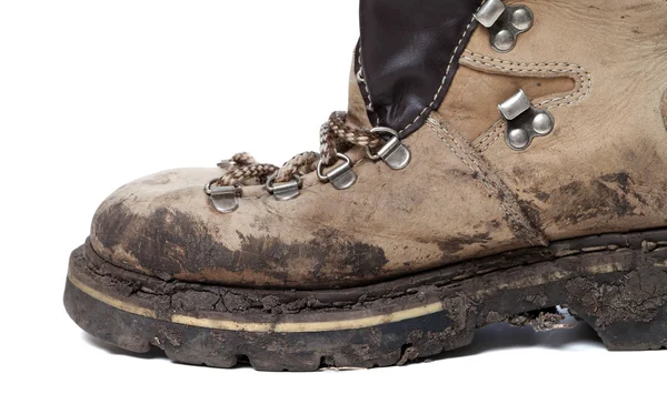 Old trekking boot in mud — Stock Photo, Image