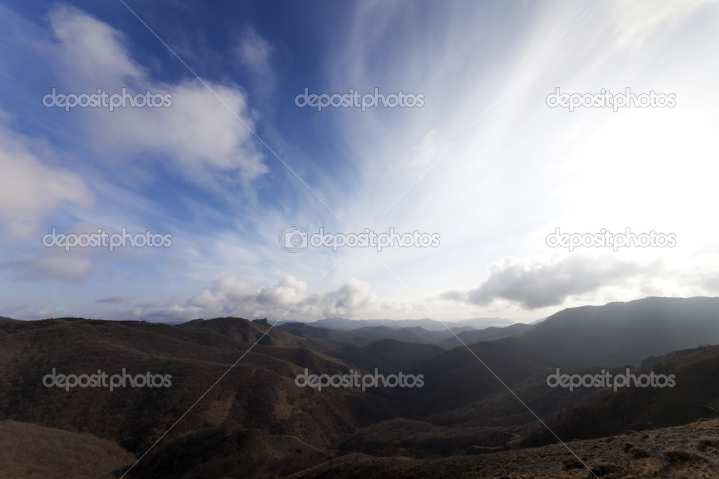 Mountains and blue sky with clouds