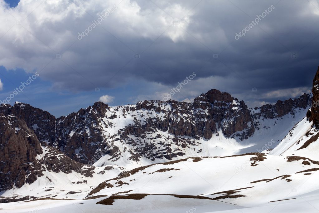 Snow mountains and sky with clouds
