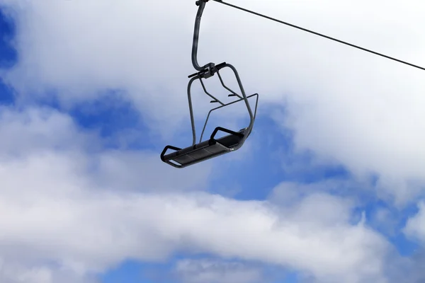 Chair-lift and blue sky with clouds — Stock Photo, Image