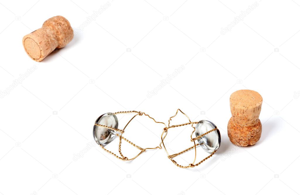 Two corks from champagne wine and muselets. Isolated on white background with copy space. Selective focus.