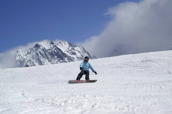 Snowboarder Downhill Ski Slope High Snowy Mountains Sun Winter Day Stock Picture