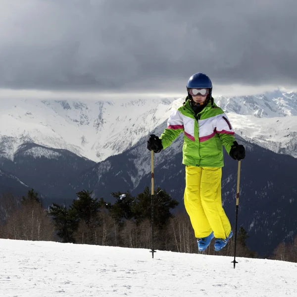 Young Skier Jump Ski Poles Snowy Sun Mountains Cloudy Gray — Stockfoto