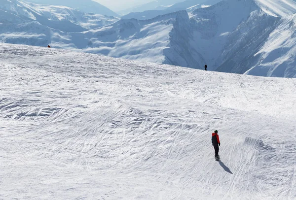 Snowboarder Skiers Downhill Snowy Piste Slope Sun Winter Morning Caucasus — Stock Photo, Image