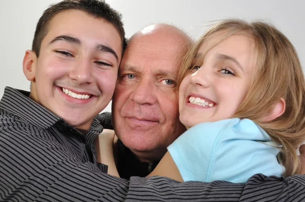 Family portrait of elderly father with children Stock Photo
