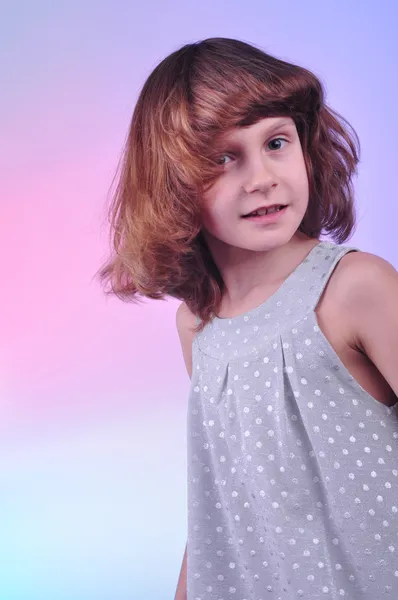 Pretty 8 year old girl in silver dress — Stock Photo, Image