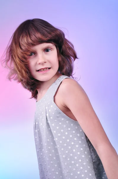 Pretty 8 year old girl in silver dress — Stock Photo, Image