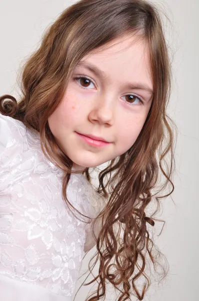 Pretty 8 year old girl in white dress — Stock Photo, Image