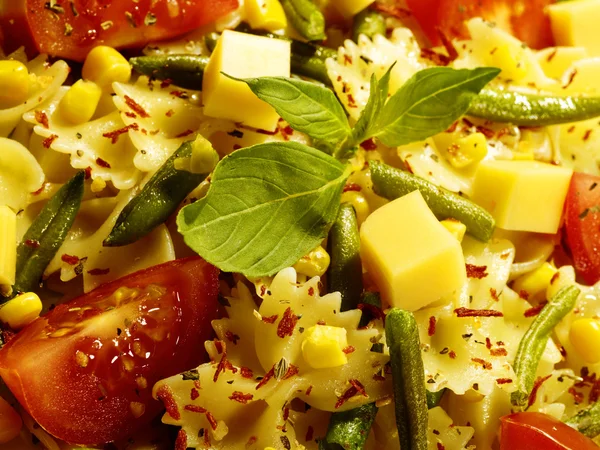 Italian pasta with string beans cheese and spices on the plate — Stock Photo, Image