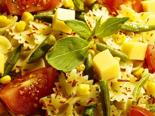 Italian pasta with string beans cheese and spices on the plate Royalty Free Stock Photos