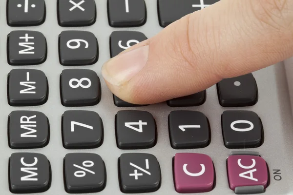 Calculator with finger — Stock Photo, Image