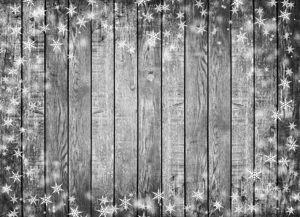 Textura de parede de madeira cinza com neve branca e estrelas — Fotografia de Stock