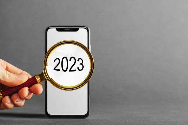 Cellphone Phone Tablet Hand Advertisement Grey Backgrounds 2023 New Year — Fotografie, imagine de stoc