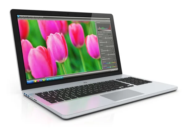 Laptop with photo editing software — Stock Photo, Image