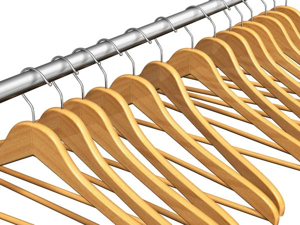 Wooden coat hangers on clothes rail — Stock Photo, Image