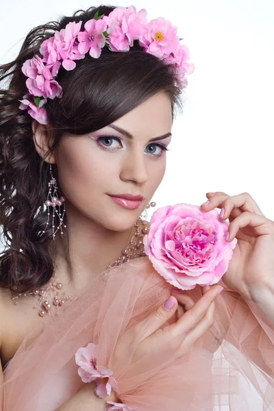 Brunette beautiful woman with flowers — Stock Photo, Image