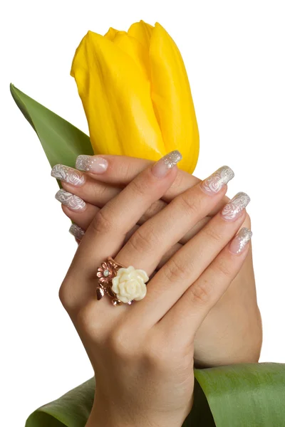 Hand with manicure and tulip — Stock Photo, Image