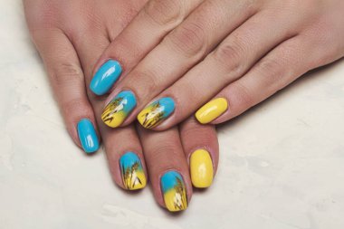 Blue yellow nail art with drawn wheat