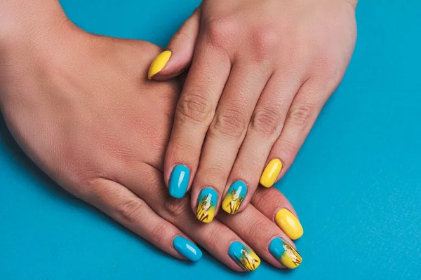 Blue yellow nail art with drawn wheat