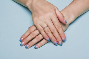 Blue winter nail art design on light background