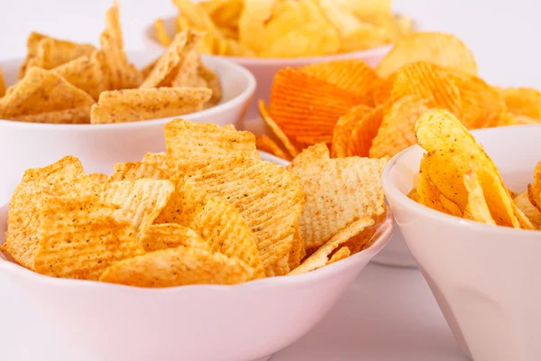 Potato and wheat chips in bowls — Stock Photo, Image