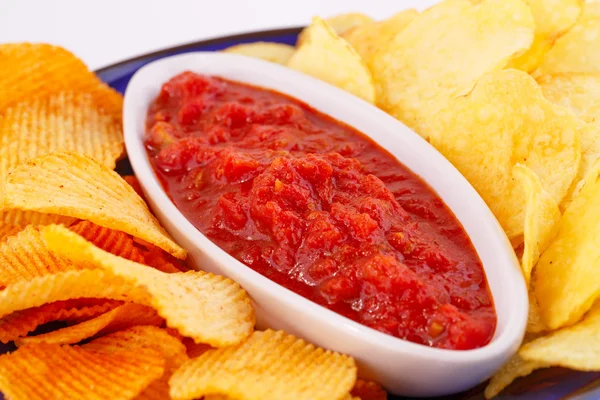 Potato chips and red sauce — Stock Photo, Image