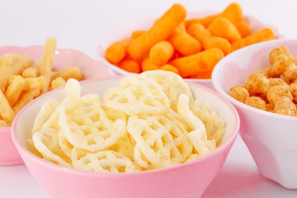 Potato, corn and wheat chips in bowls — Stock Photo, Image