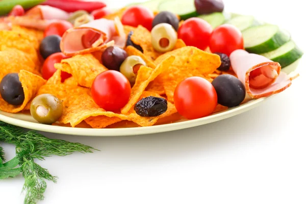 Nachos, olives, pork loin and vegetables — Stock Photo, Image