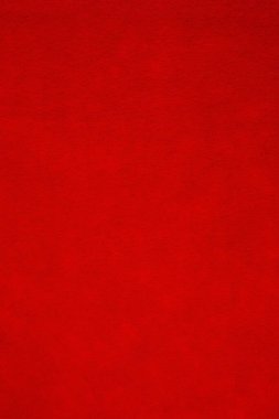 Arka plan olarak kırmızı kumaş dokusu. Sevgililer Günü ve Noel arkaplanı için dikey görüntü.