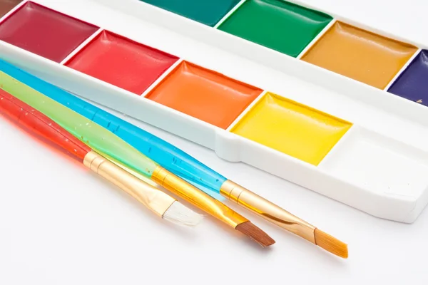 Paints and brushes — Stock Photo, Image