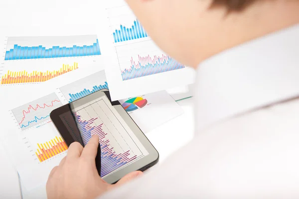 Businessman analyzing with tablet pc — Stock Photo, Image