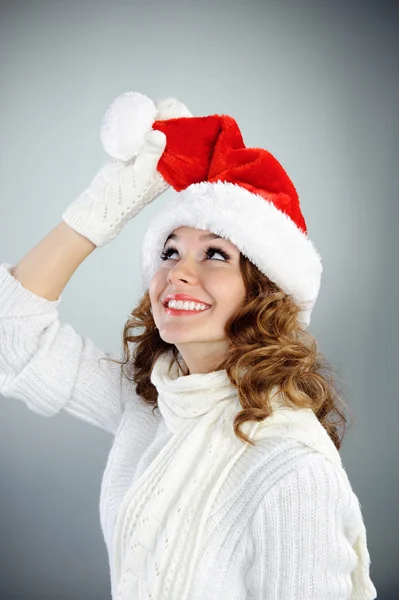 Attractive young woman in red Santa hat — Stock Photo, Image