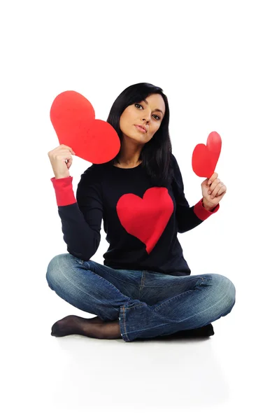 Beautiful young woman with red hearts isolated on white — Stock Photo, Image