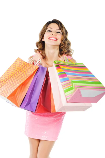 Młoda wesoła dziewczyna z torby na zakupy na białym tle — Zdjęcie stockowe