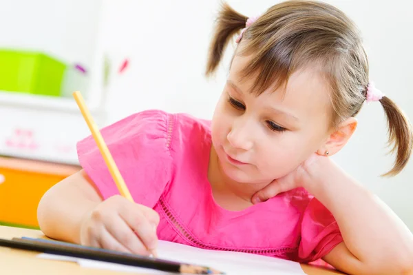 Cute little girl study at home Stock Photo