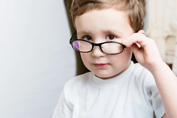 Portrait of serious kid in glasses — Stock Photo, Image