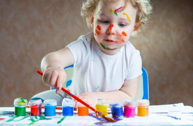 Cute little child painting