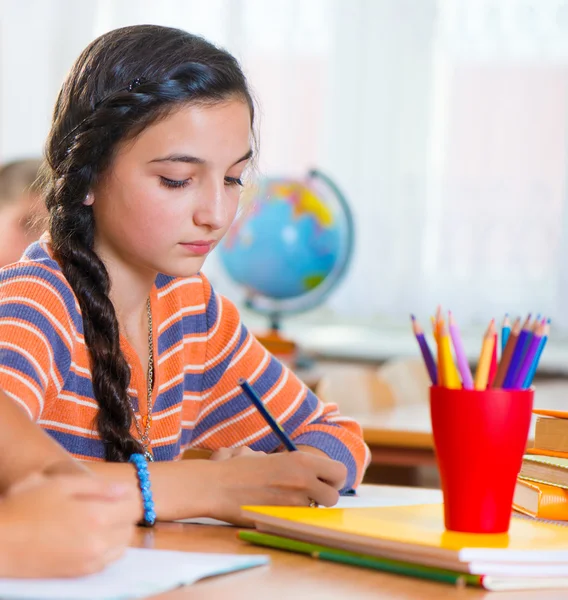 Cute girl in classroom at school Stock Image
