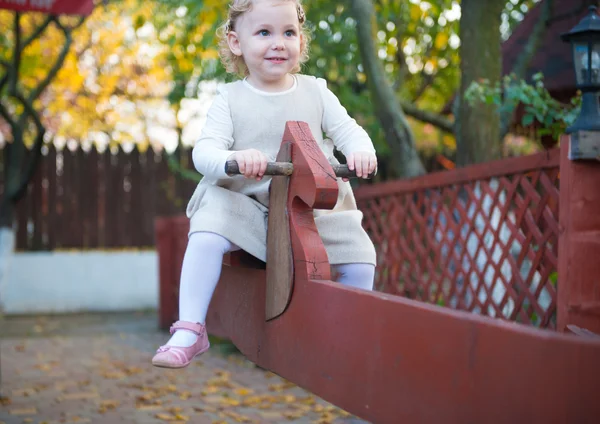 Cute little girl at playground — Stock Photo, Image