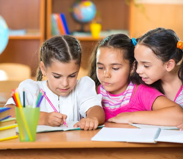 Happy pupils at school — Stock Photo, Image