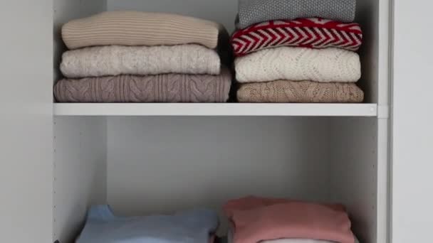 60Fps Video Neatly Folded Clothes Camera Moves Vertically — Stock Video